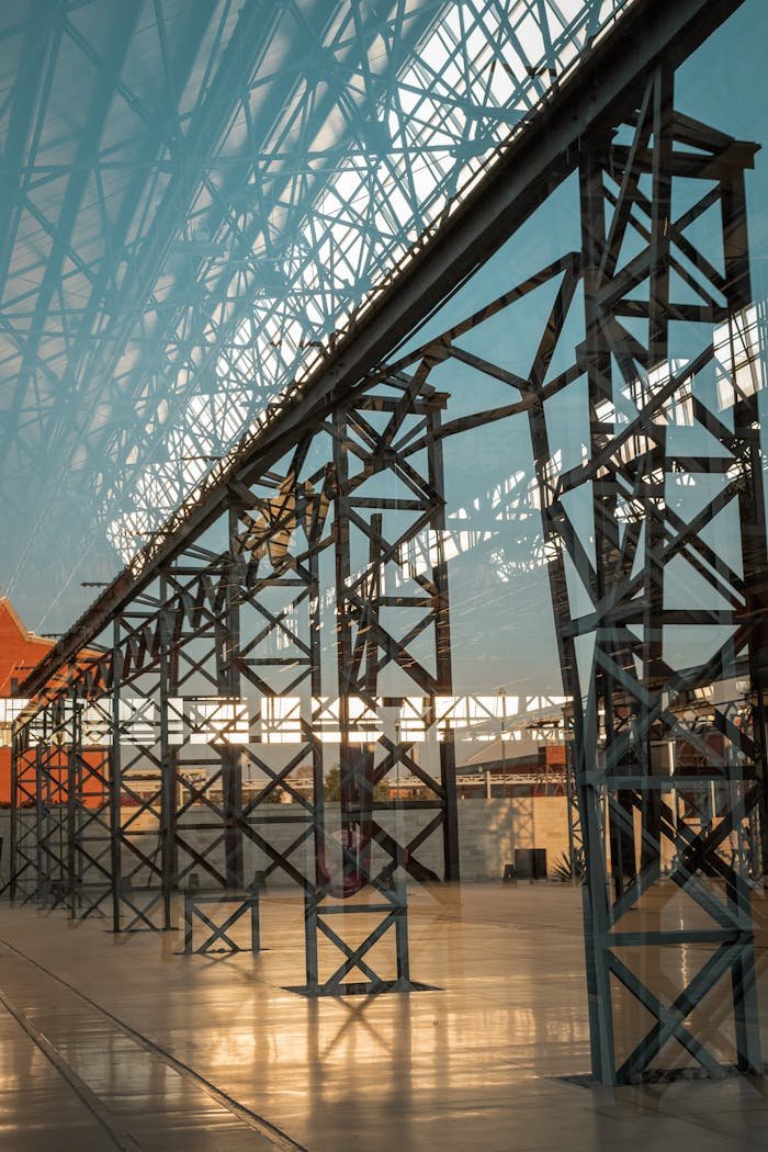 Services A steel framework with glass reflections creating a modern architectural vibe.